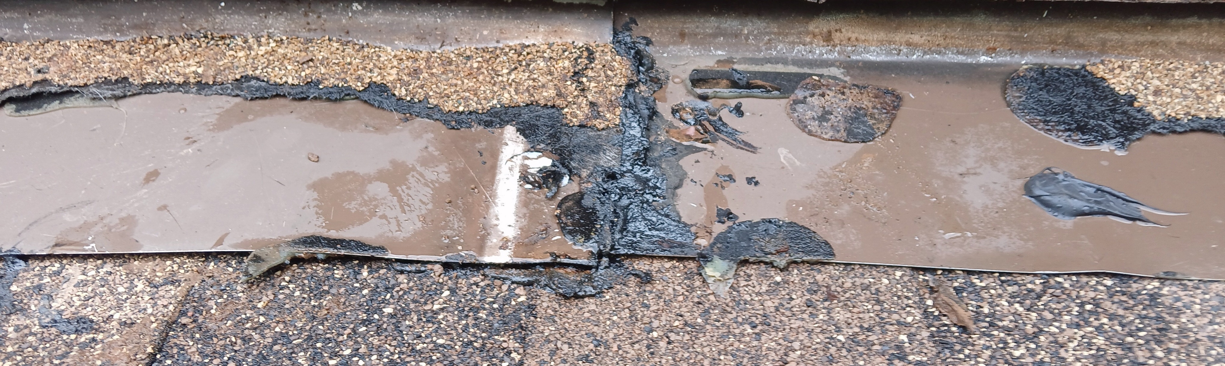 Re-used damaged roofing materials and improper installation by Summit Roofing